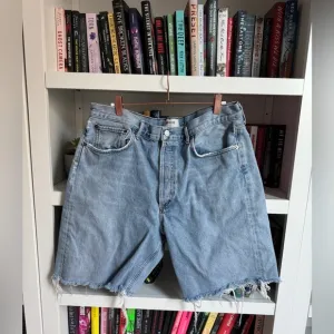 Agolde light wash distressed cut off 90s organic cotton retro denim jean shorts